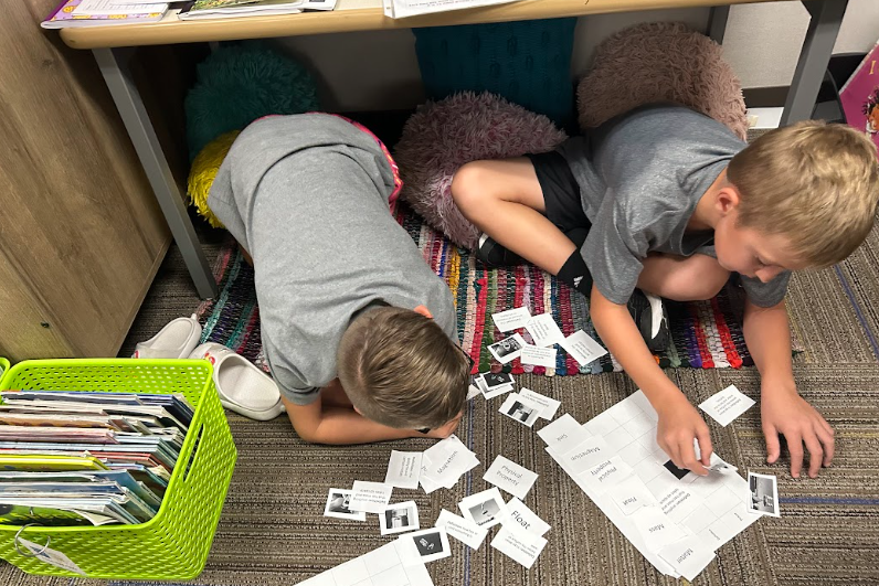 Third Graders  working with partners on matter vocabulary by matching words, definitions and images.
