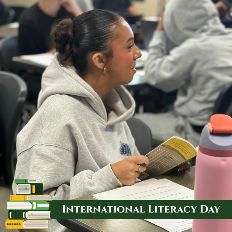 Junior Gabby Granillo discusses Of Mice and Men during class. Graphic banner says International Literacy Day with a stack of books in the bottom left corner. 
