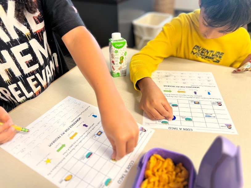 first graders are practicing their computational skills by creating an algorithm and giving specific directions, one step at a time