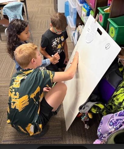 Third Graders working on vertical boards.