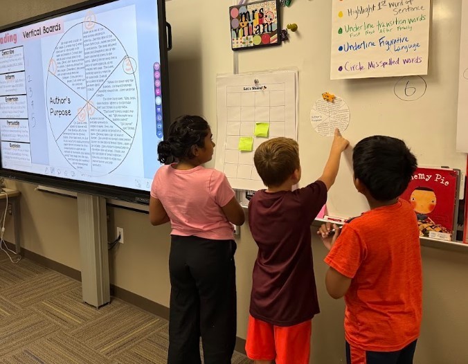 Third Graders working on vertical boards.