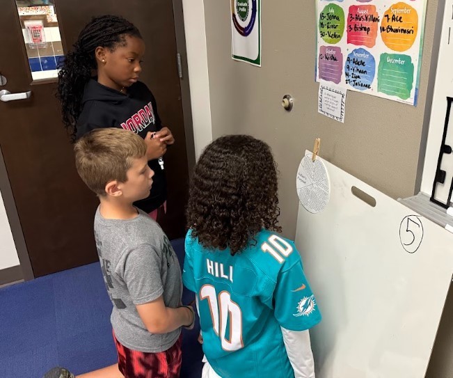 Third Graders working on vertical boards.