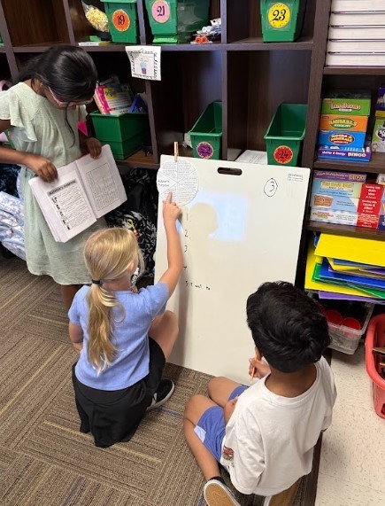 Third Graders working on vertical boards.