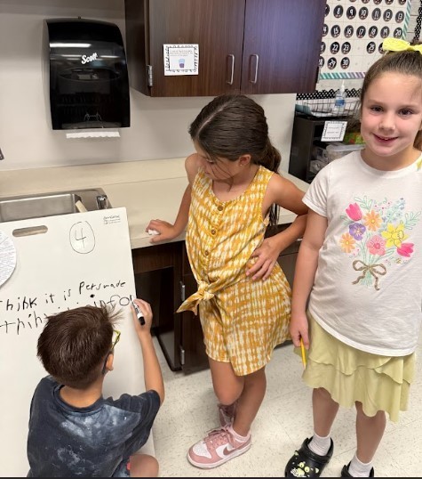 Third Graders working on vertical boards.