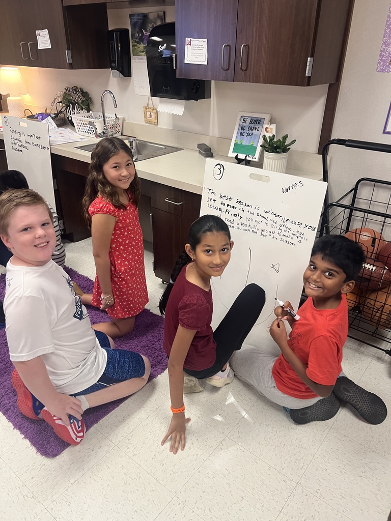 Fourth Graders writing SROs on Vertical Boards.