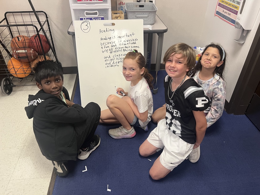 Fourth Graders writing SRPs on Vertical Boards.
