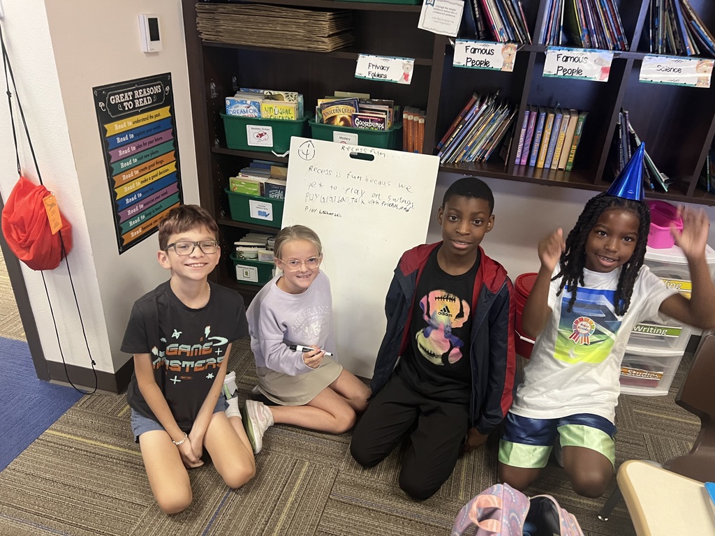 Fourth Graders writing SRPs on Vertical Boards.