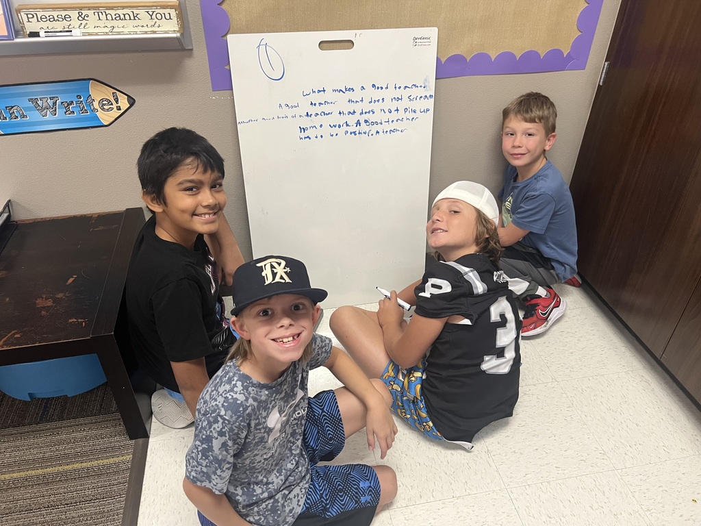 Fourth Graders writing SROs on Vertical Boards.