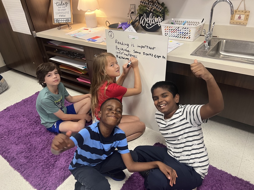Fourth Graders writing SROs on Vertical Boards.