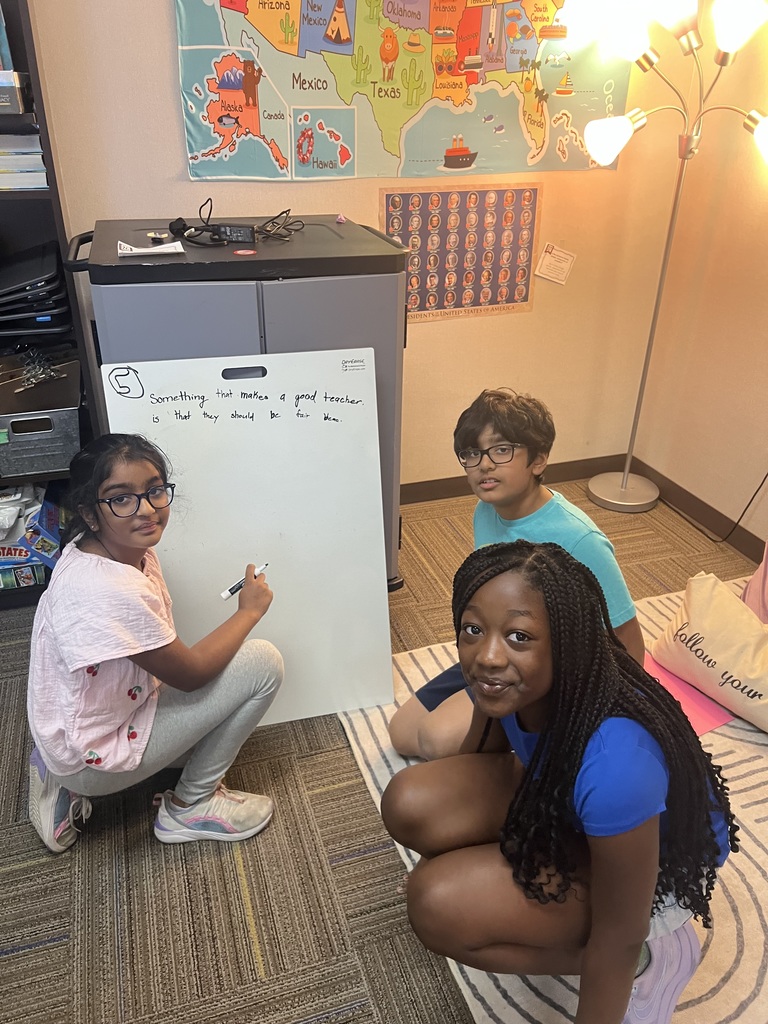 Fourth Graders writing SROs on Vertical Boards.