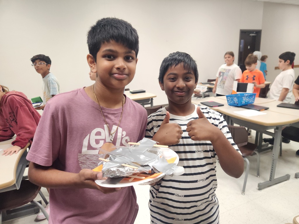 Miss Harig's fifth graders are ready to test their boats! They used the engineering design process to build boats that can hold 100 pennies without sinking.