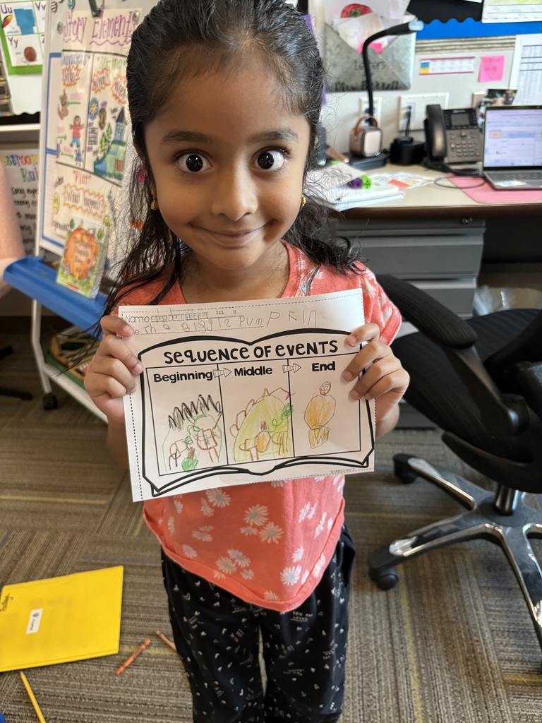 Kindergarteners writing.