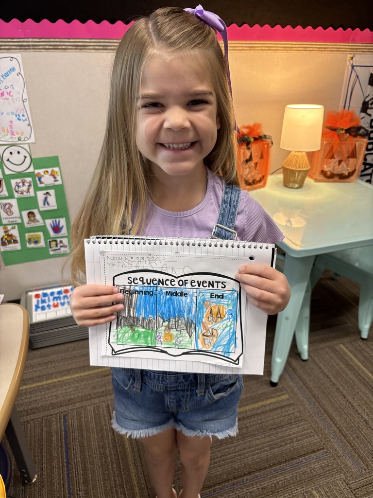 Kindergarteners writing.