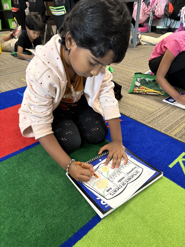 Kindergarteners writing.