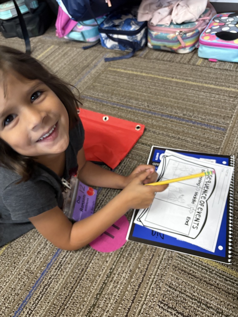 Kindergarteners writing.