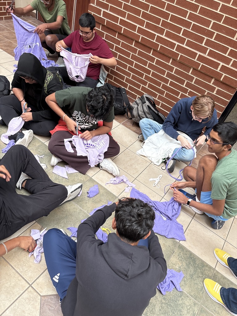 Students making cat toys