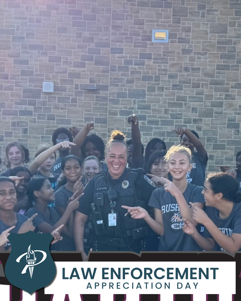 OFFICER SMILING WITH STUDENTS
