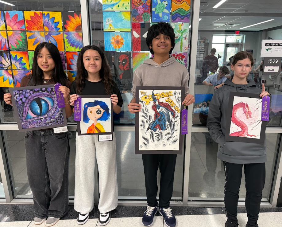 Photo of students with their best of show artwork