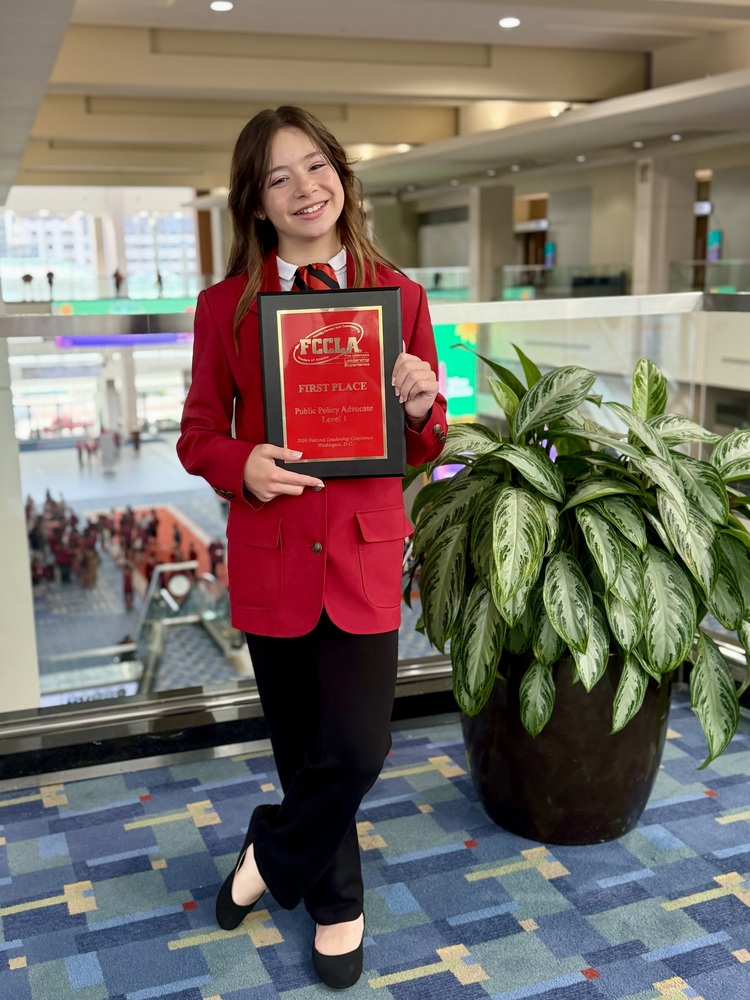 Carly with award.
