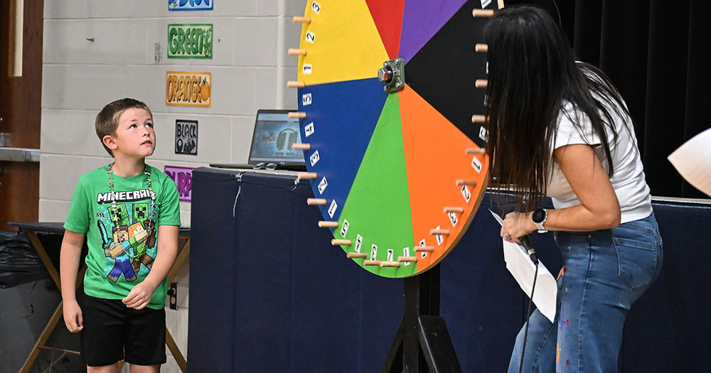 boy spins the wheel