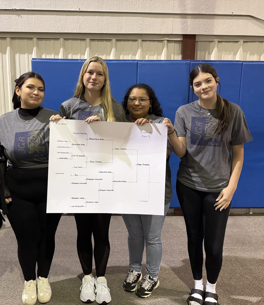 four girls holding poster