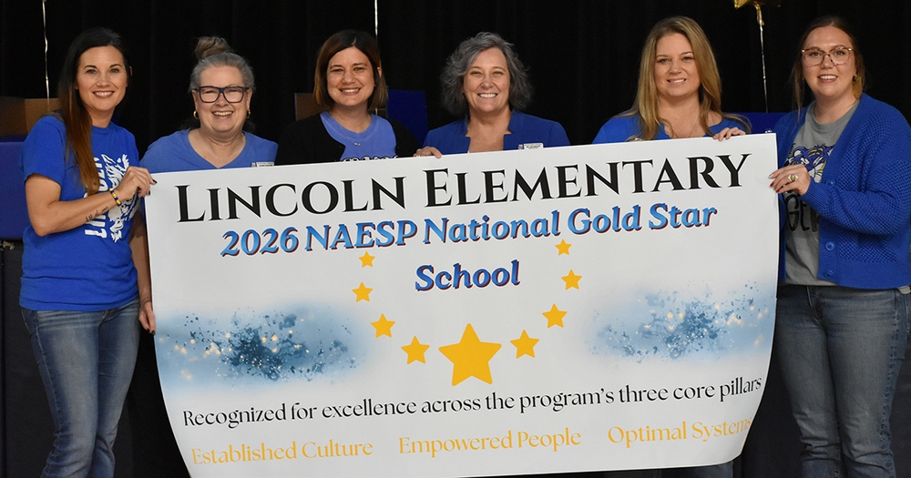 admin holding banner