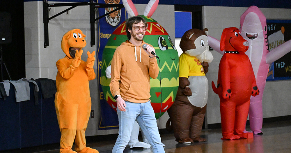 announcer and five masked readers