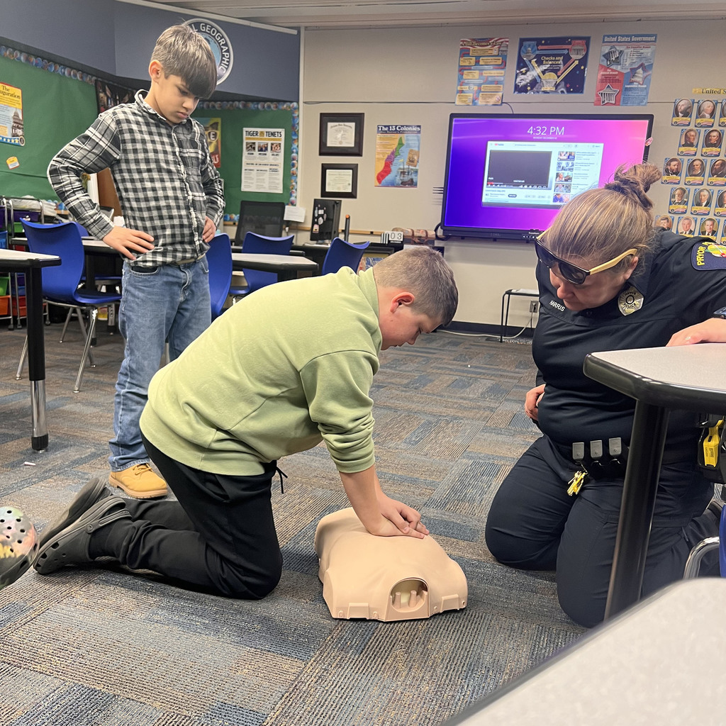 Little boy giving CPR