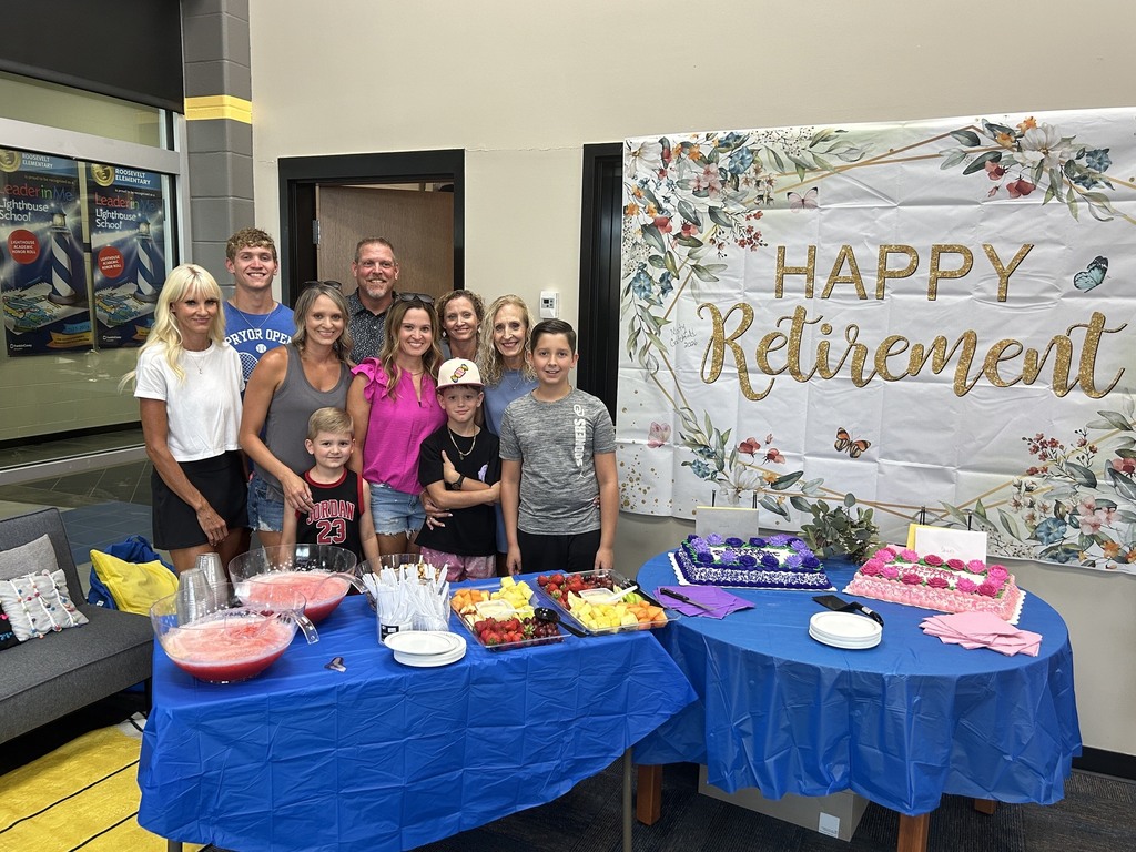 Family standing in front of retirement banner