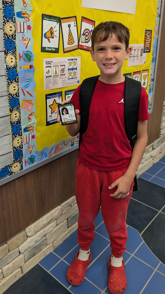 boy holding card