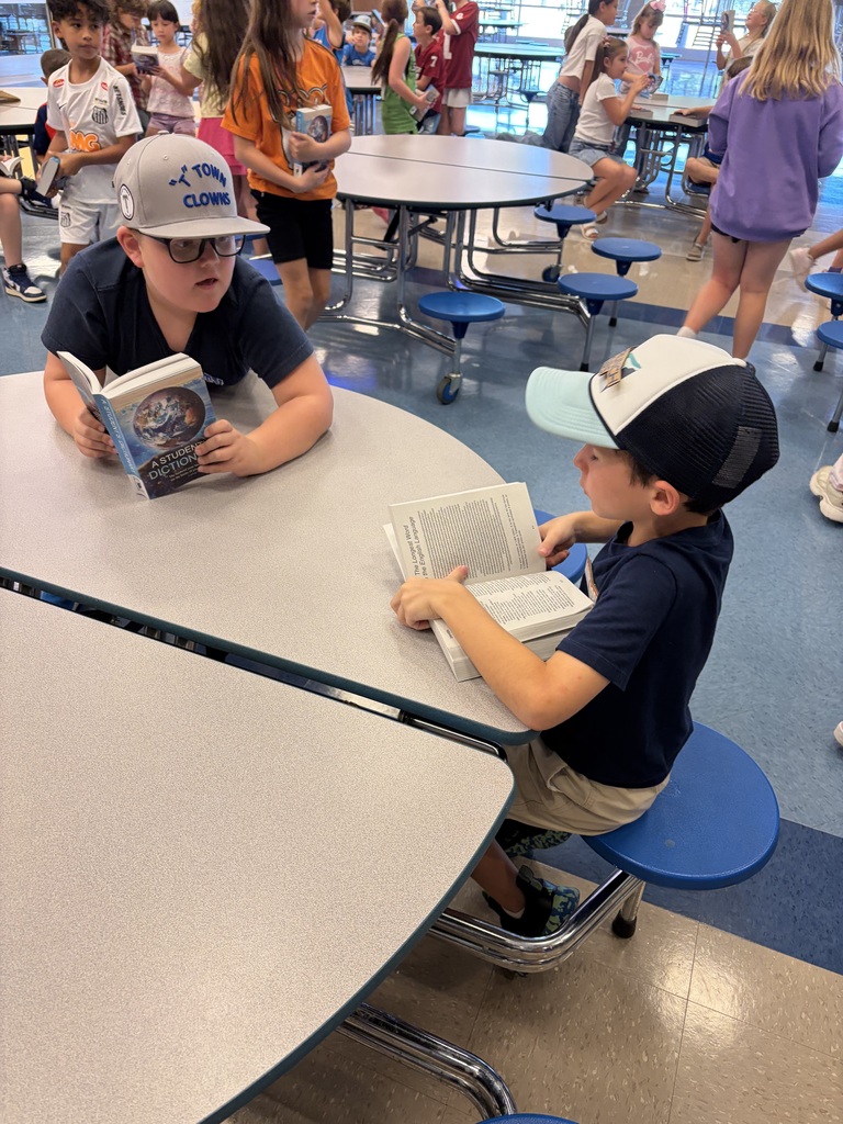 boys reading at the table