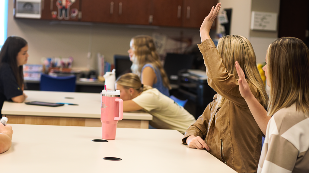 Girls raising hand