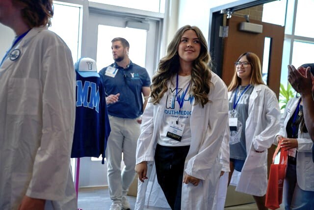 Student walking in and looking around