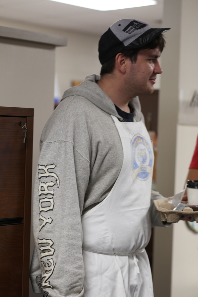 Student hold a tray of coffee