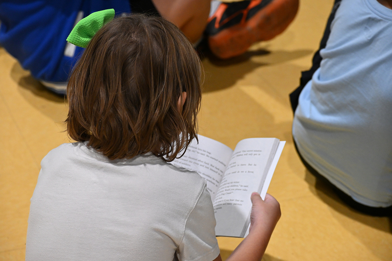 student reading the book