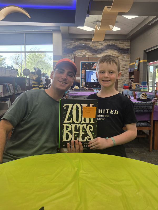 young boy with author