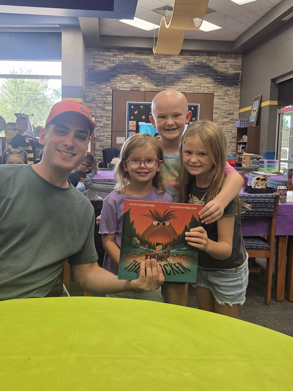 three students with author
