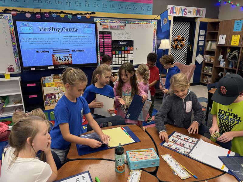 group of students around cards