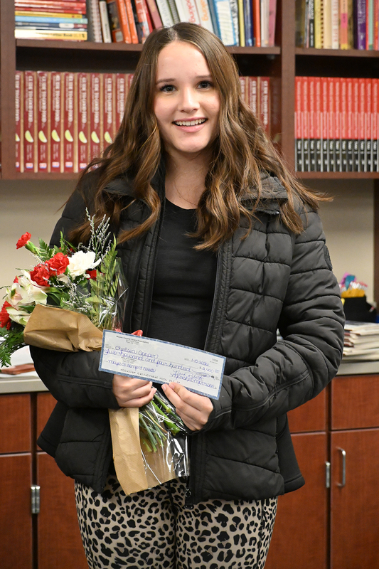 chelsea cooper with check