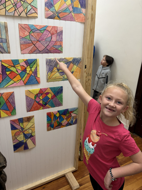 girls points to her work