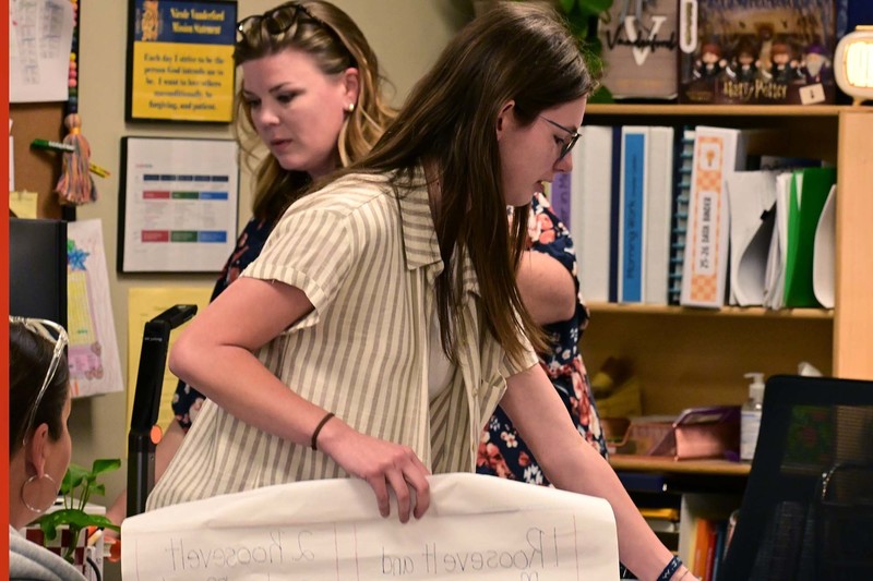 student and regular teacher working together