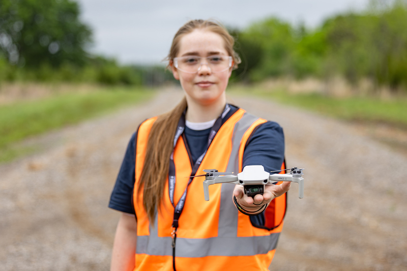 girl holding drone