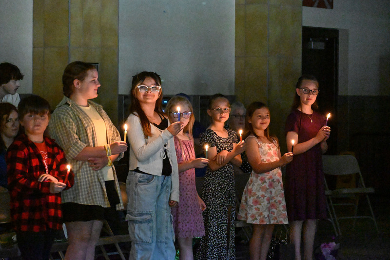new leaders holding candles