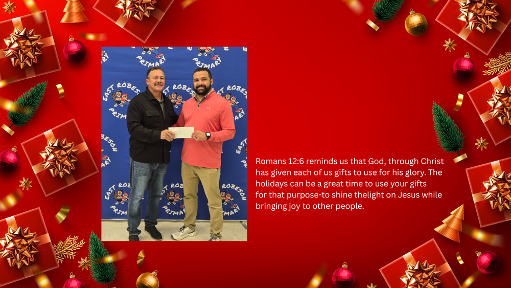Principal at Esat Robeson School (Chad Brewer) recieving a donation to our Angel Tree Project from Burnt Swamp Baptist Association(Steve Strickland)