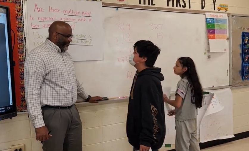Principal Steven Sinclair participates in a 5th grade Math Review