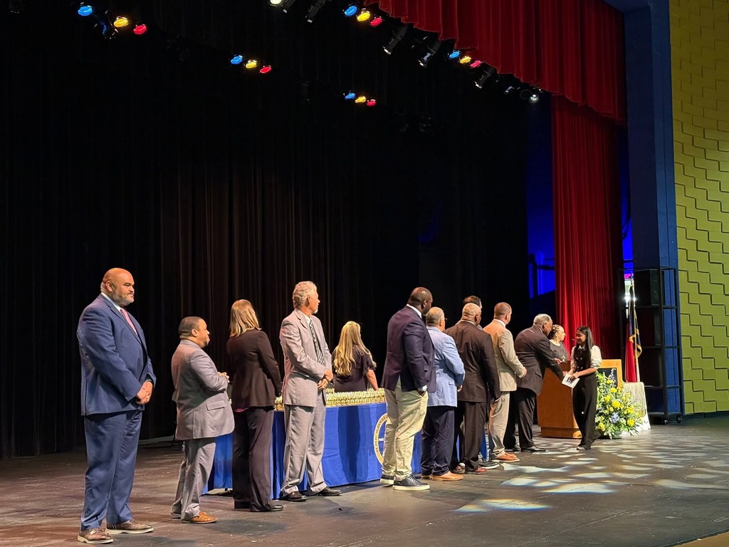 Ella receiving award