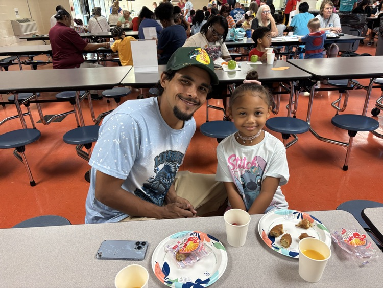 A family sharing breakfast at school