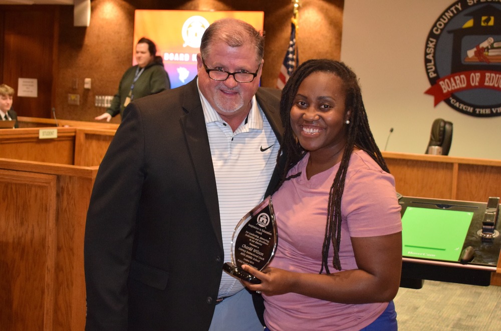 Superintendent Senn and October 2025 Inspiration in Education winner Charde’ Wilson pose with her award