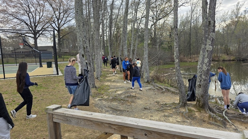 Students cleaning up at a park