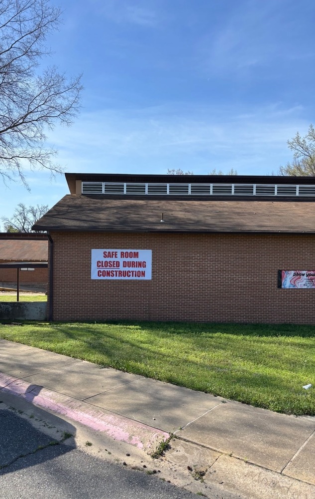 Side view of College Station with closed sign